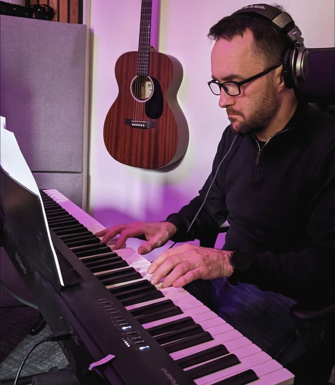 A picture taken of the artist Ola Palmkvist while he's making a kind smile 